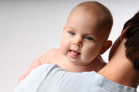 A little cheery baby girl with mommy