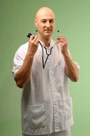 Young doctor taking his stheoscopeの写真素材