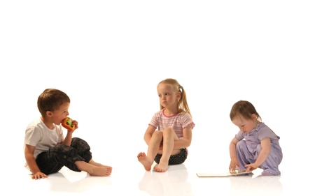 Three siblings rplaying togetherの写真素材