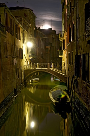 Romantic picture of canal in Venice at nightの写真素材