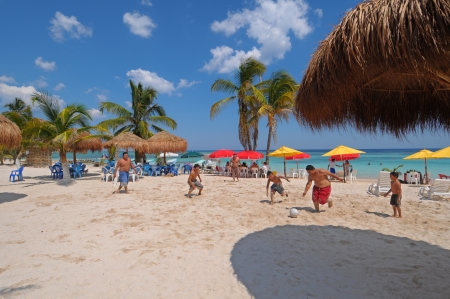 People playing soccer on the beach of Mahahual in Mexicoのeditorial素材