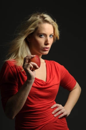 Picture of young woman holding appleの写真素材