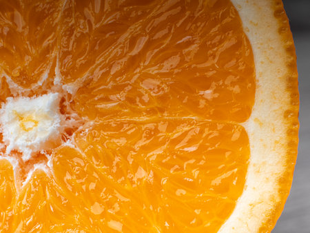 Macro photo of an orange slice in a cut. Concept of fresh juice and fruitの写真素材