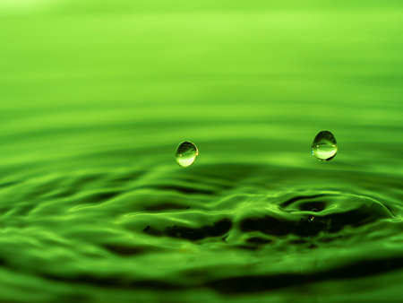 Splashing a drop of water into the aquarium. Colorful water drop