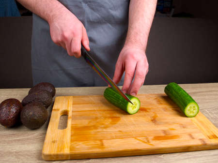Young chef learning to cook rolls from different products, making rolls and sushi at home, japanese food concept.の写真素材