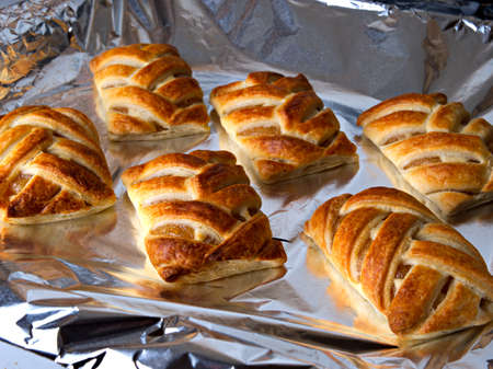 Making homemade apple buns, baking buns in the oven, home cooking concept.の写真素材