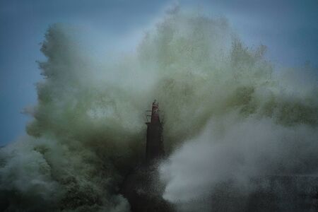 Waves breaking in the lighthouse of Viavelez, Asturiasの写真素材