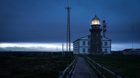 Sunset in the Cabo de Peñas lighthouse last summerの写真素材