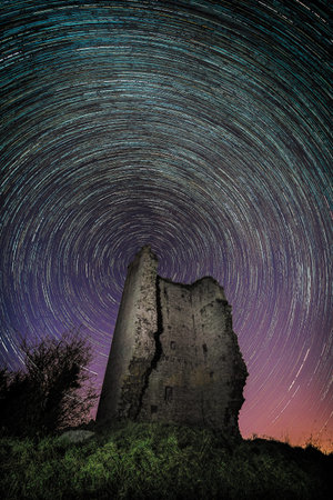 Photograph of circumpolar stars in the abandoned tower of Peñerudes, Asturias, Spain