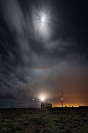 Full Moon at the Cape of Pe?as Lighthouse on the Asturian coastの写真素材