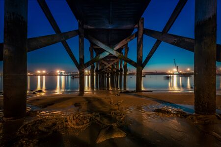 Night on the river of Aviles under a bridge IIの写真素材