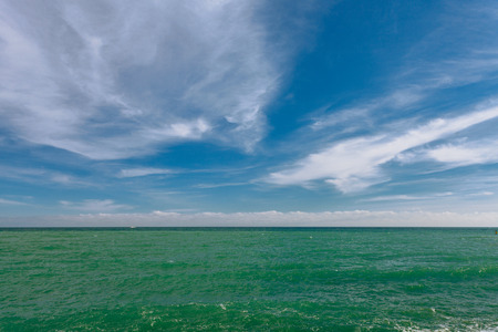 Views of the waterfront and waves of the sea in the Bay of Yalta in the winter sunny day. Yalta. Crimea. Russiaの写真素材