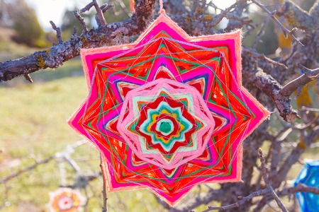 Ethnic elements. The product is handmade. Woven of colored thread. Element trance party decoration. Crimea. Forest. Ukraine. Russiaの写真素材