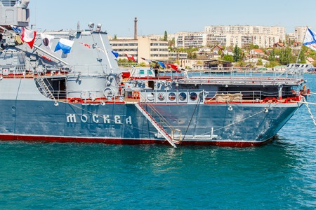SEVASTOPOL CRIMEA MAY 9: Parade of the Russian warships celebrating in honor of 70th anniversary of Victory Day on May 9th 2015 Russian Navy flagship cruiser Moskva in the Sevastopol Bay Crimeaのeditorial素材
