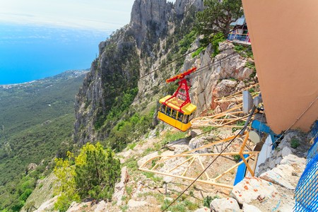 MISHOR, CRIMEA, UKRAINE - MAY 12. People travel by rope way cab on top of Ai-Petri Mountain on May 12, 2013 in Mishor, Ukraine.Russia. This road has one of the longest unsupported span in Europe.のeditorial素材