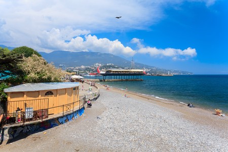 YALTA - MAY 17: People are walking along the Lenina Embankment with boutiques buildings on May 17, 2013 in Yalta, Ukraine.Russia.のeditorial素材