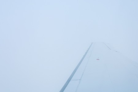 Beautiful view from the aircraft to the clouds and the earthの写真素材