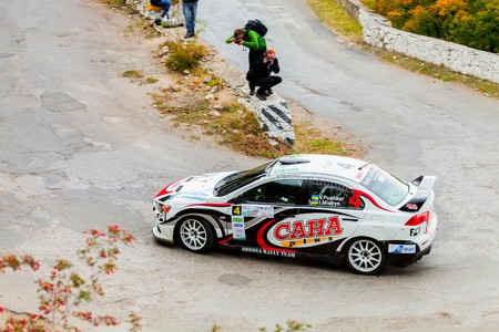 YALTA, UKRAINE - SEPTEMBER 14. Vitaliy Pushkar drives his Mitsubishi Lancer during the WOG Yalta Rally Fest 2013. 2 day. on September 14, 2013 in Yalta, Ukraine.のeditorial素材