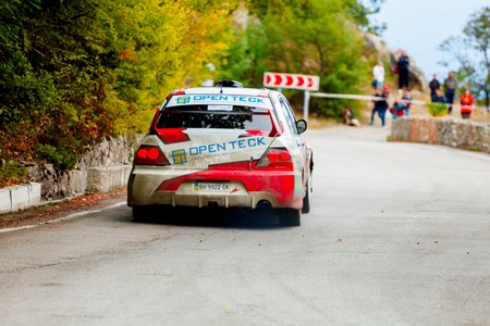 YALTA, UKRAINE - SEPTEMBER 14. Yuri Kochmar drives his Mitsubishi Lancer during the WOG Yalta Rally Fest 2013. 2 day. on September 14, 2013 in Yalta, Ukraine.のeditorial素材