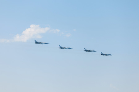 Crimea - 26 July 2015: parade in honor of the Day Russian Navy in Sevastopol. Flight Su-24 over the bay of the cityのeditorial素材