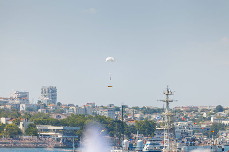 Crimea - 26 July 2015: parade in honor of the Day Russian Navy in Sevastopol. Flight MI-8 helicopter over the bay of the cityのeditorial素材
