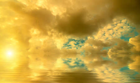 Colorful Golden sea sunset. Cumulus cloud cover. Natural compositionの写真素材