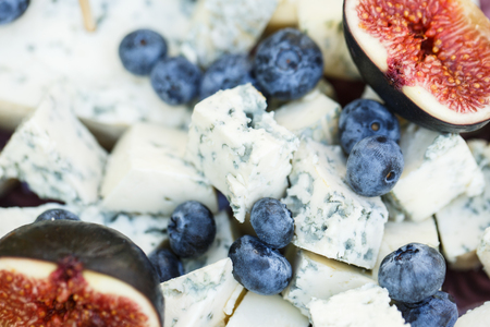 Cheese dorblu with blueberries and figs. Macro.の写真素材