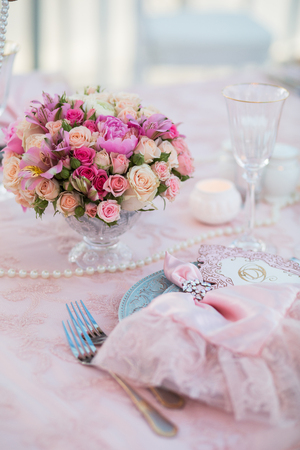 Table setting at a luxury wedding decorated with composition of flowers.の写真素材
