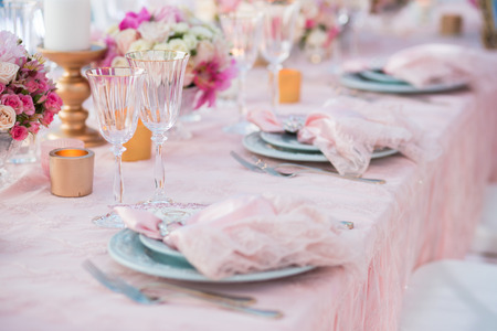 Table setting at a luxury wedding decorated with composition of flowers.の写真素材