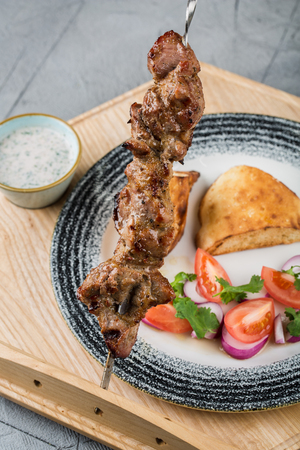 pork shish kebab with garnishの写真素材