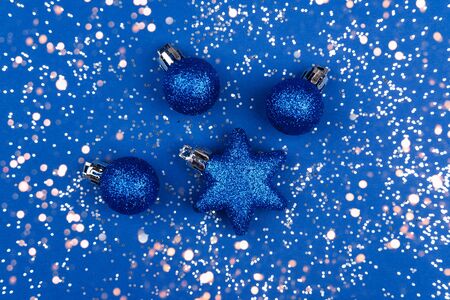 Shiny Christmas toys in blue. Christmas background color of the year classic blue 2020.の写真素材
