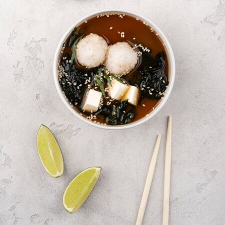 Miso soup with rice, tofu cheese and wakame seaweed. A traditional Japanese dish. Food delivery.の写真素材