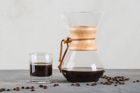 A device for brewing coffee using a filter. Close up on the table.の写真素材