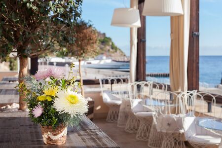 Outdoor summer terrace in a cafe by the sea.の写真素材