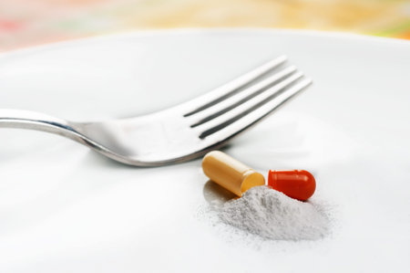 A opened pill on a plate representing a diet pill.
