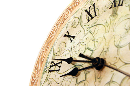 close up od a white clock with roman numerals