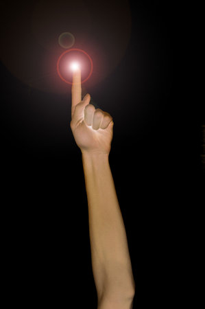 Pointing fingertip with light, pointing up.