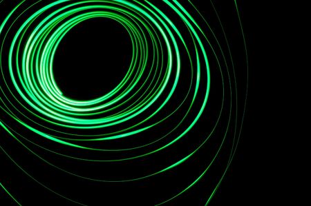 A glowing green physiogram on a black backgroundの写真素材