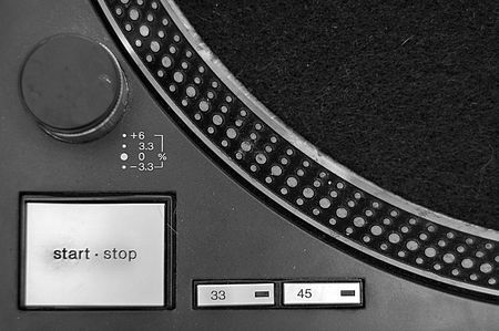 Close up of a turntable with start/stop, 33, and 45 buttons.の写真素材