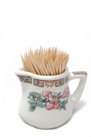 Toothpicks in little jar isolated on white backgroundの写真素材