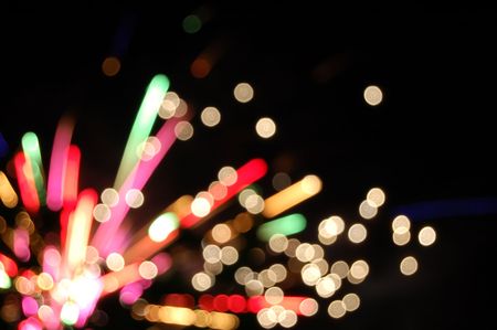 An out of focus long exposure photo of fireworks exploding.の写真素材