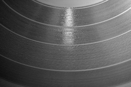 Close up of a 12 inch vinyl music LP record disc.の写真素材