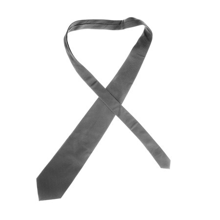 Folded gray tie with geometric designs on it. isolated on white.の写真素材