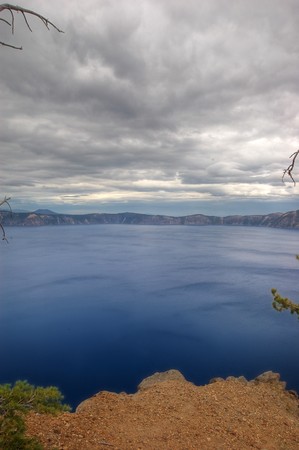 Massive body of water in a crater lake, located in Oregon. Lots of blue empty copyspace of water and clouds.の写真素材
