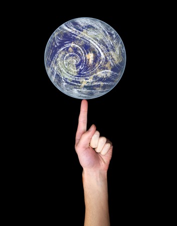 Hand isolated on black background balances the Earth on his finger.の写真素材