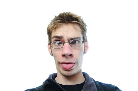 Young white male sticks his tongue out isolated on white backgroundの写真素材