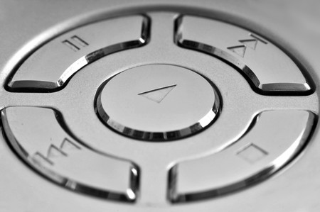 Close up of a high tech media player button. Macro shot with very shallow depth of field.の写真素材