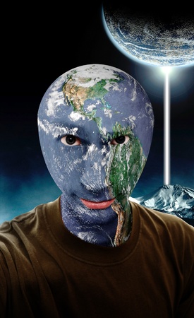 A young man with a the earth as his head.の写真素材