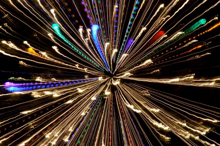 Exploding blasts of sparks burst out into the darkness of space and timeの写真素材