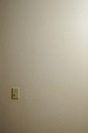 Single light switch with wall copyspaceの写真素材